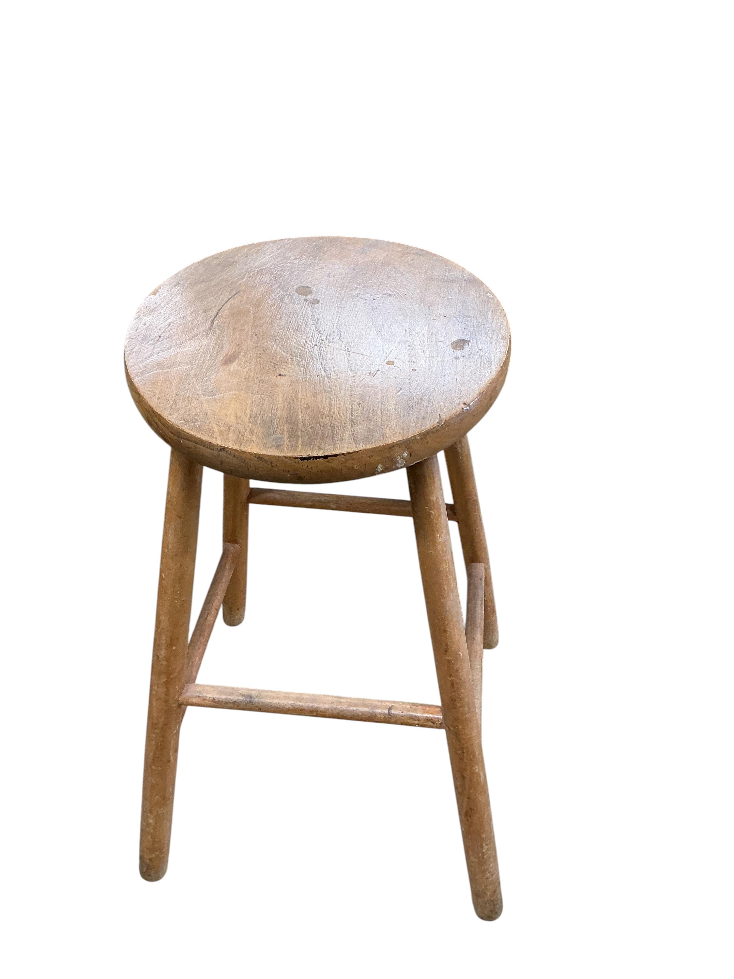A Victorian pine bedside cabinet, width 38cm, depth 35cm, height 82cm, together with two pine and beech Provincial stools